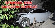 Otomobil evin bahçesine devrildi